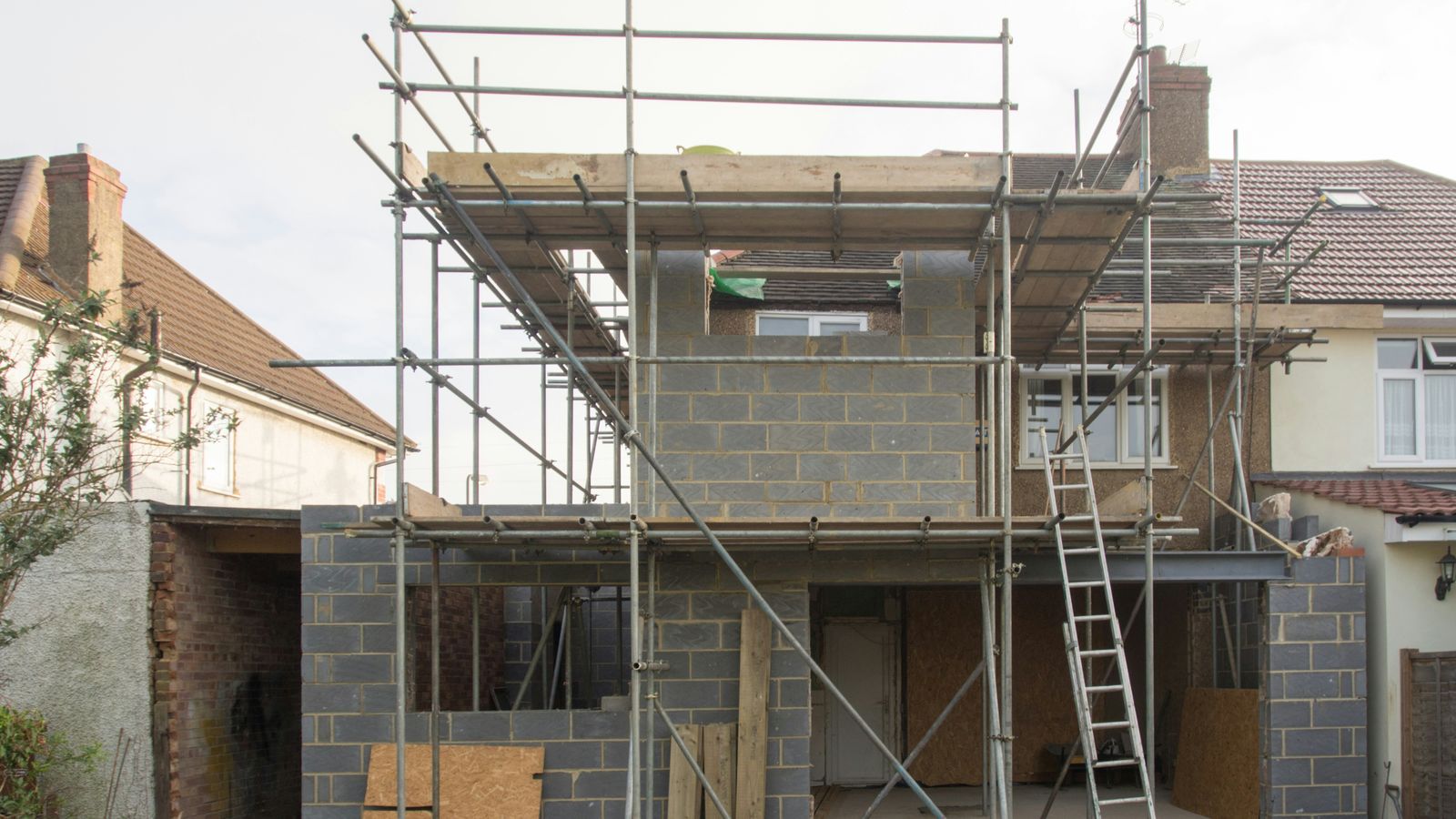 House extension under construction with scaffolding